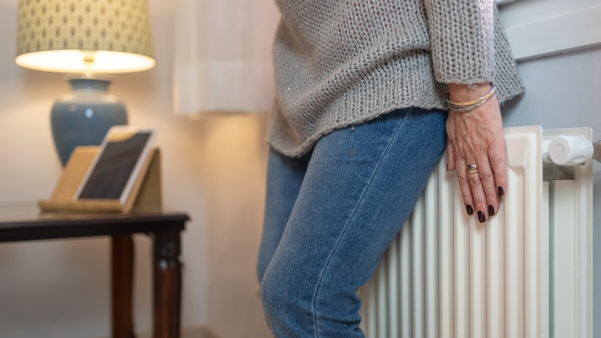 lady standing on a heater