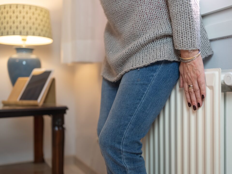 lady standing on a heater